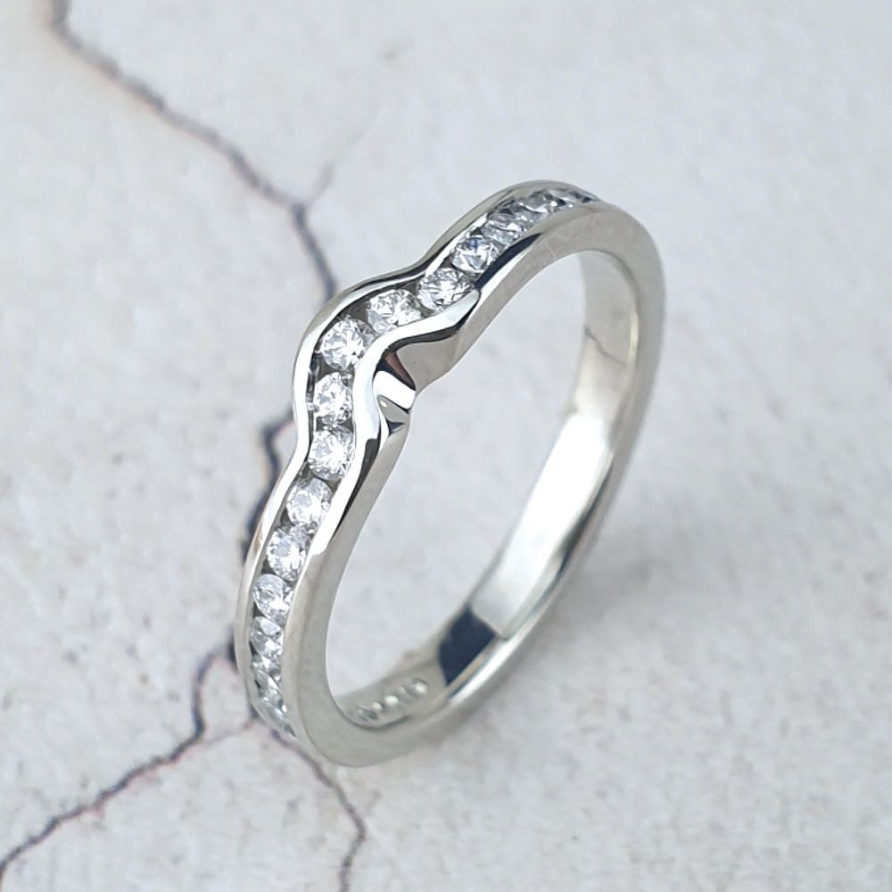 Platinum wedding ring with channel-set diamonds
