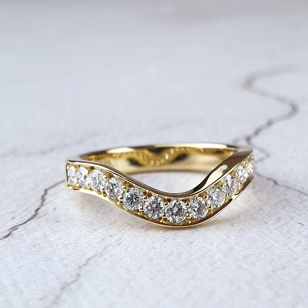 Shaped to fit wedding ring with diamonds