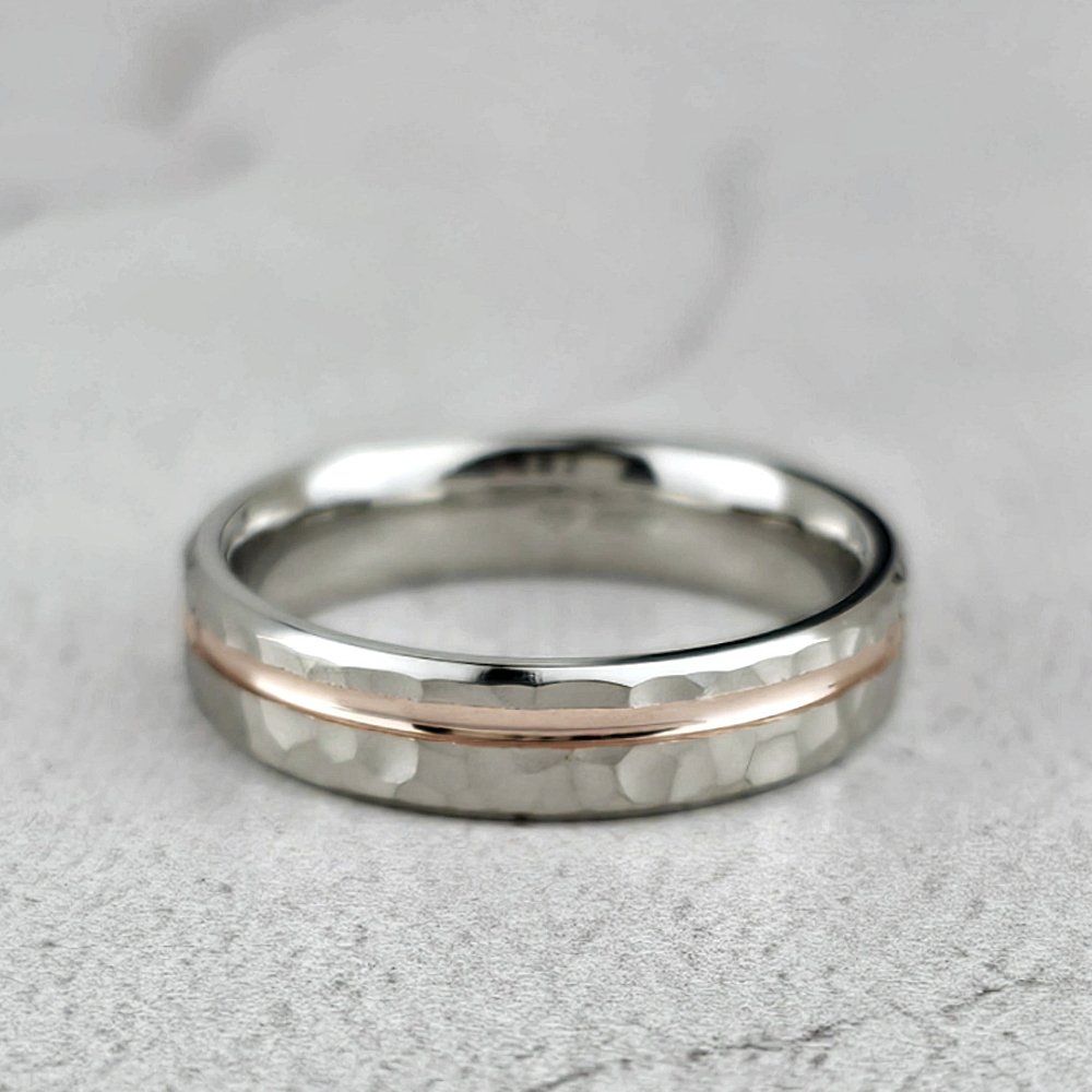 Man's platinum wedding ring with red gold groove