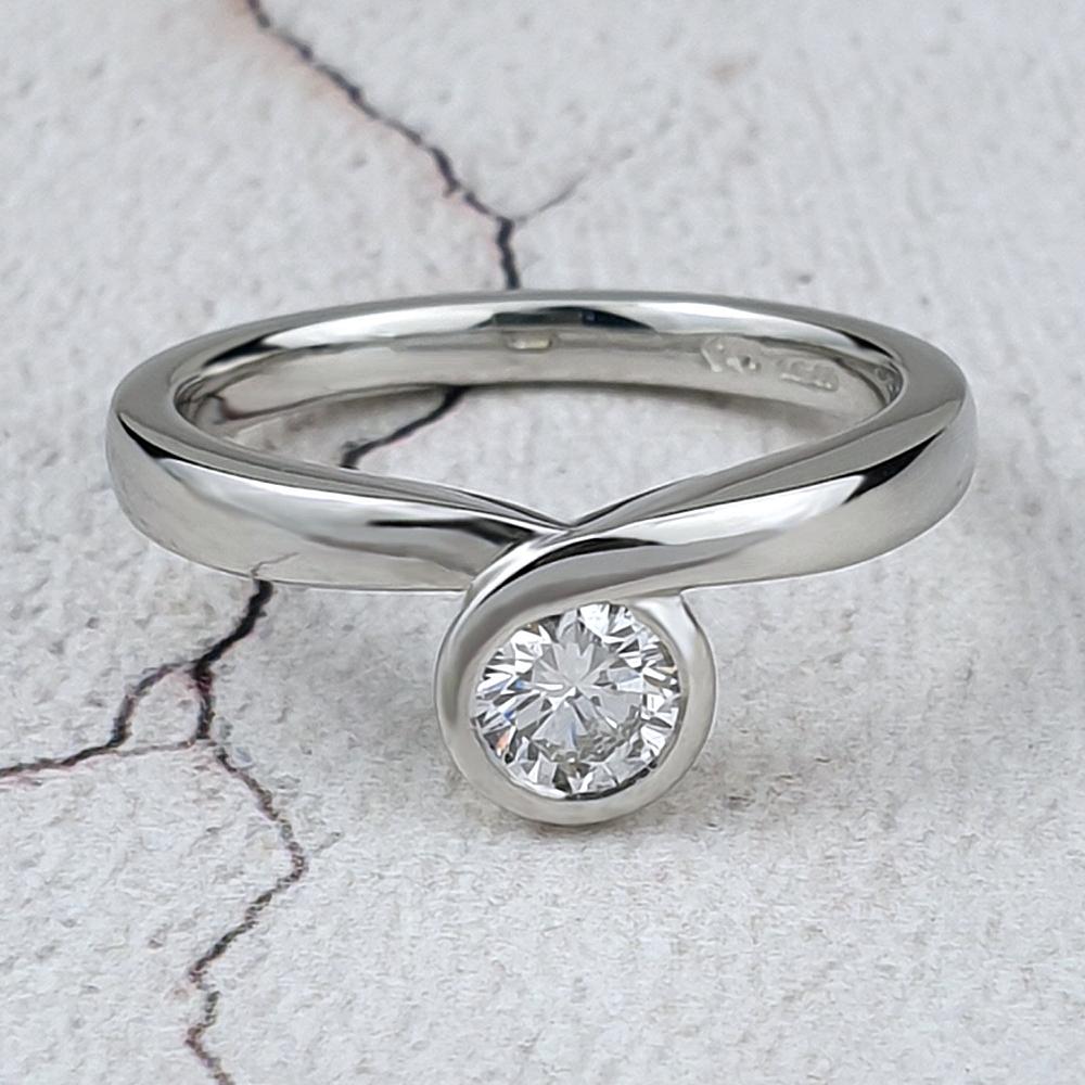 Platinum Infinity ring with round diamond