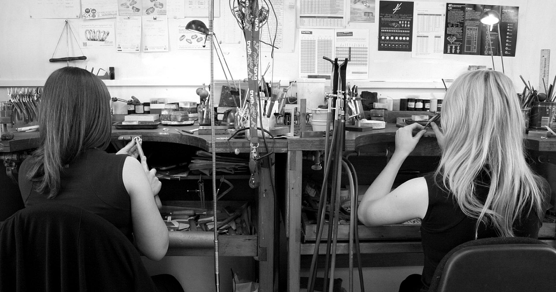 two goldsmths working a jewellers benches