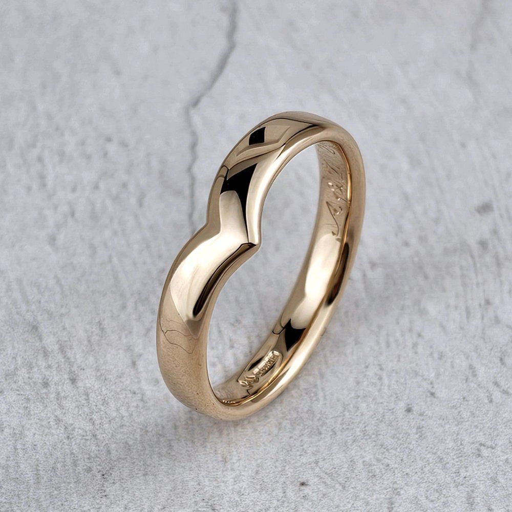 a man's wishbone style red gold wedding ring