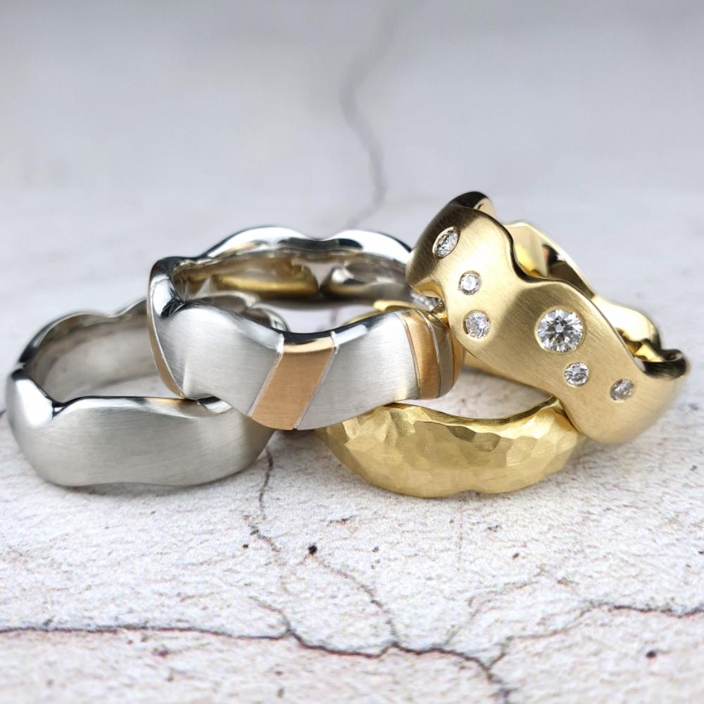 Hand carved wedding rings with different treatments