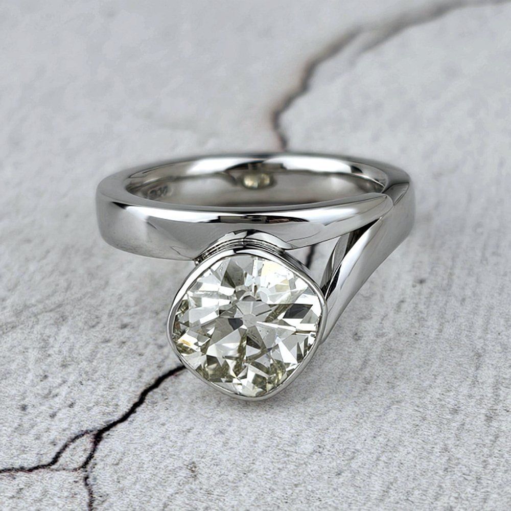 Large old cut diamond in a modern ring