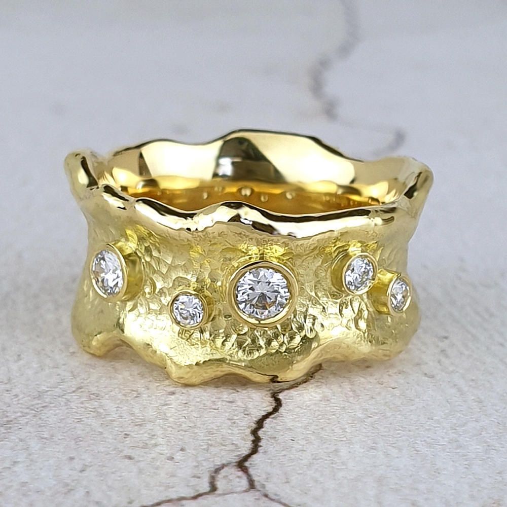 organic 18ct gold ring with melted edges and scattered diamonds