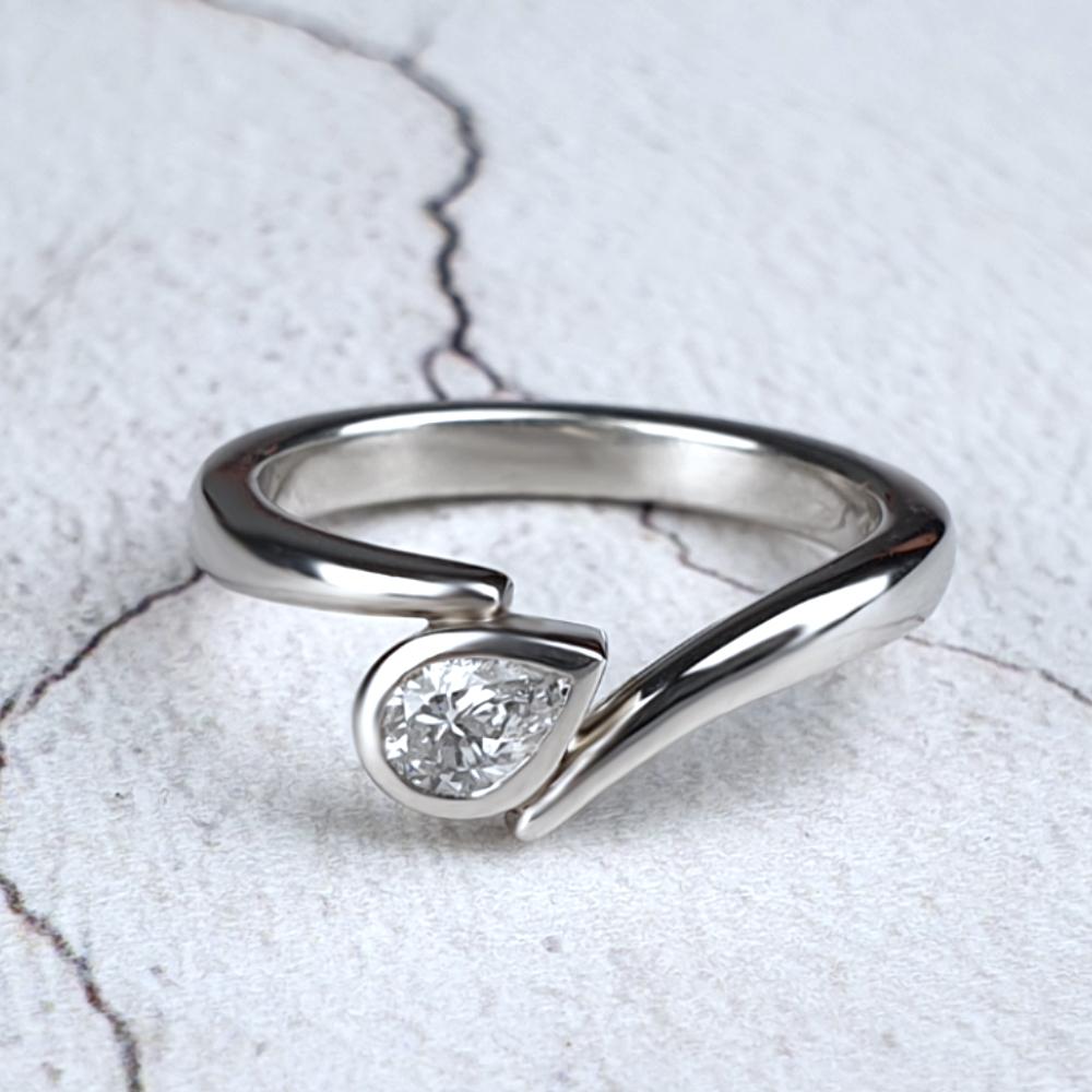 Platinum Flick with pear-shaped diamond