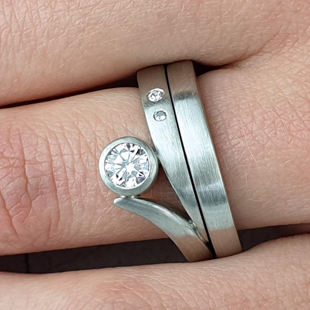 Matte platinum Flick engagement ring with matching wedding band