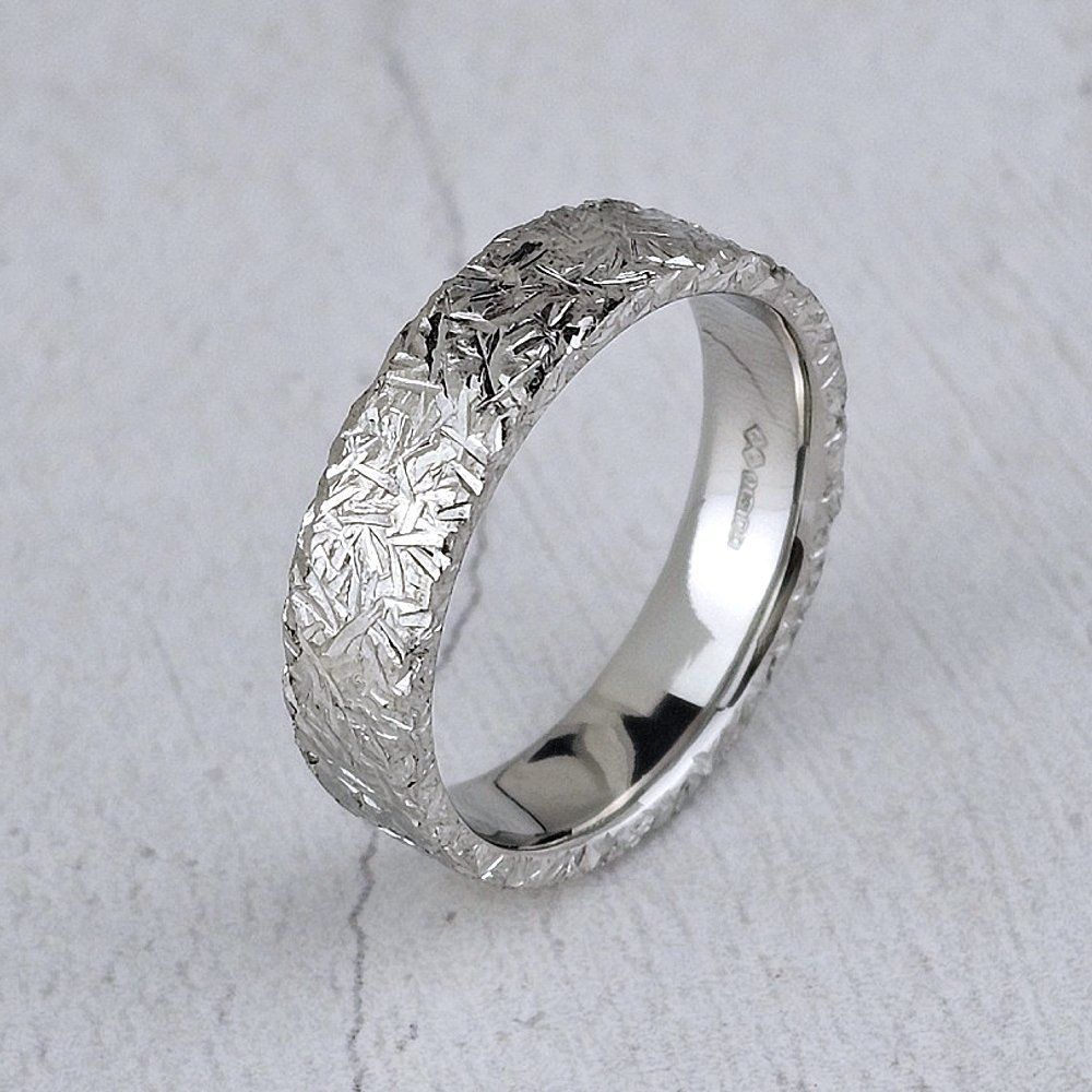 oval court wedding ring with chisel finish