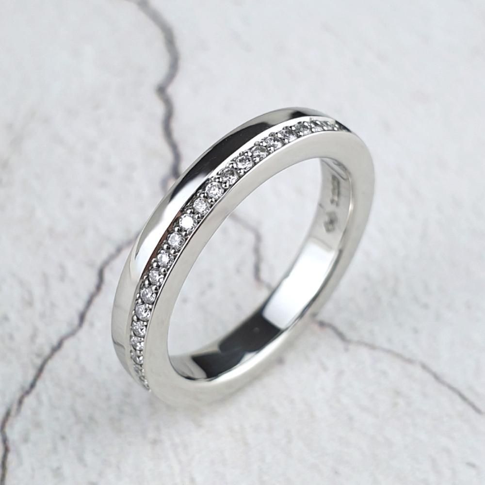 Platinum eternity ring with diamonds on one side only