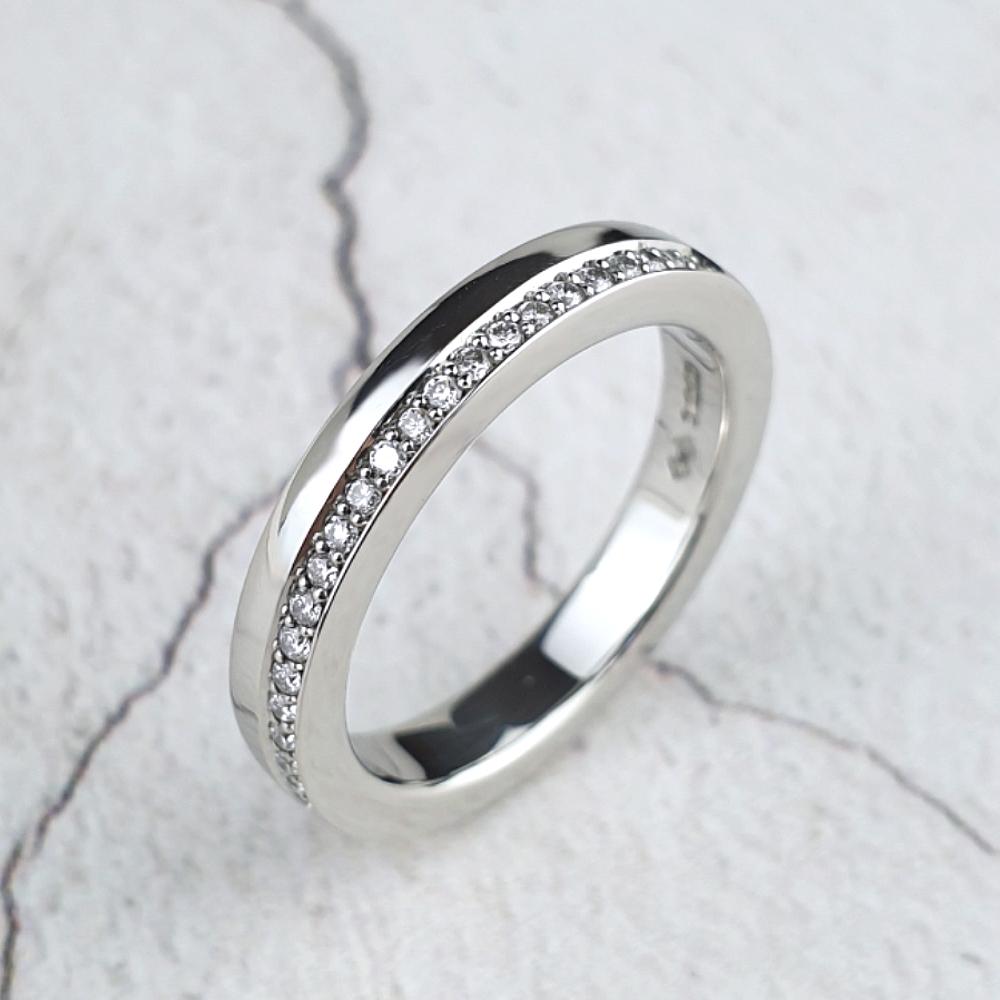 Platinum eternity ring with diamonds on one side only