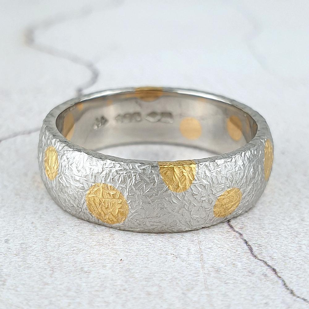 Textured platinum wedding ring with 22ct gold