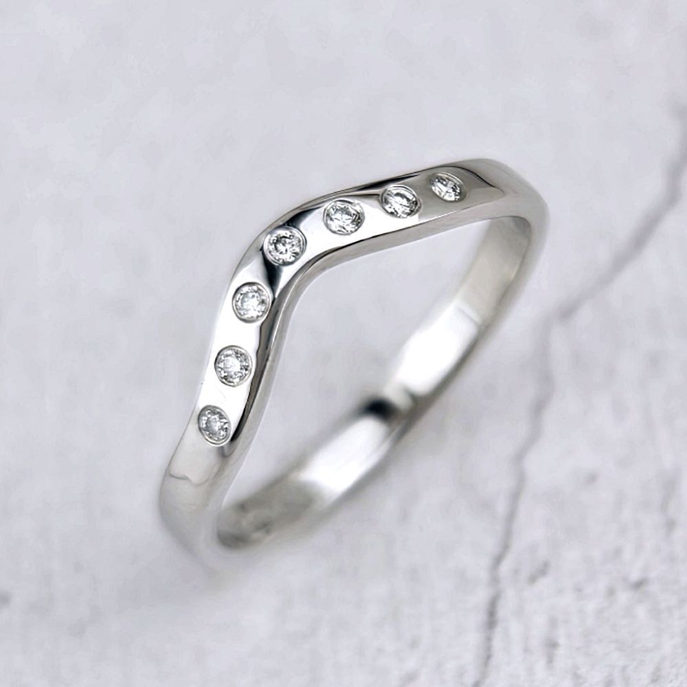 A narrow platinum band with flush-set diamonds