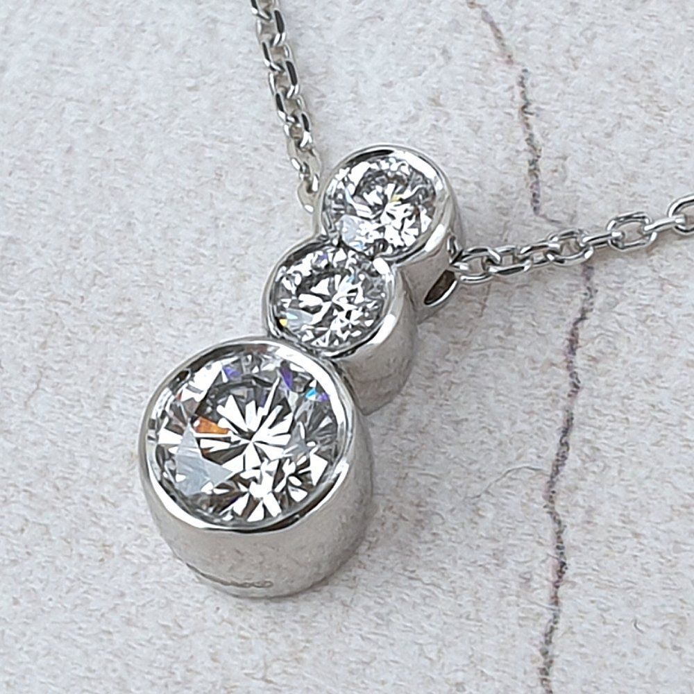 platinum pendant with three diamonds