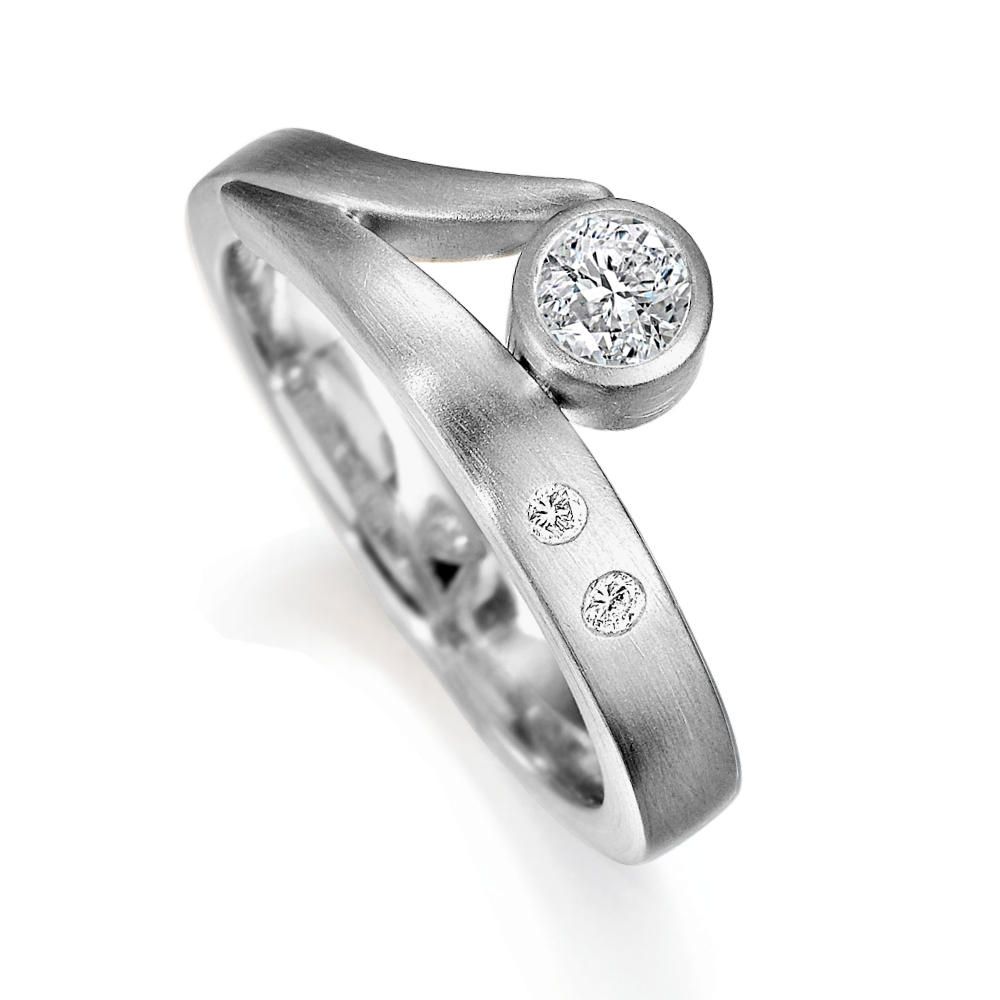 Flick engagement ring with a round diamond