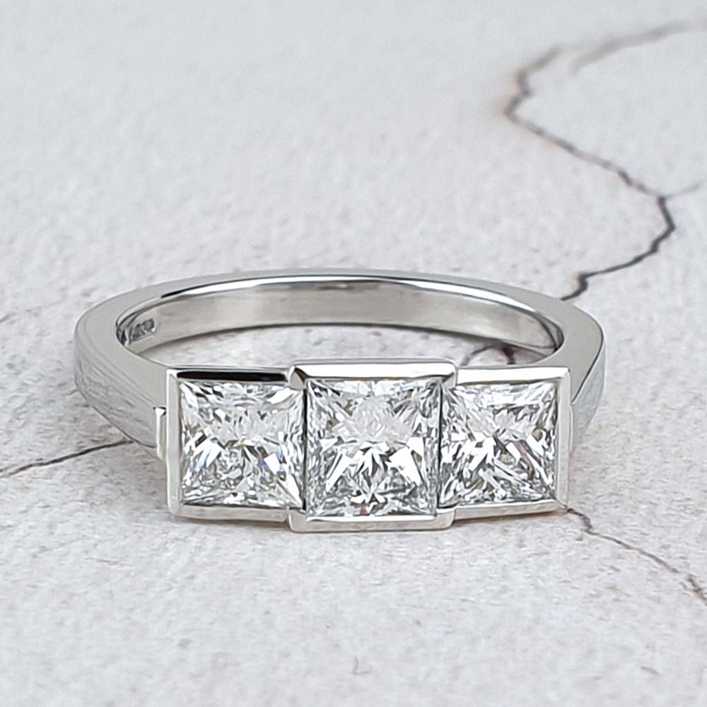 Platinum Trilogy engagement ring with princess-cut diamonds