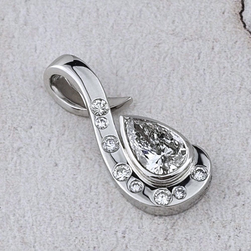 remodelled pendant in platinum with a pear shaped diamond