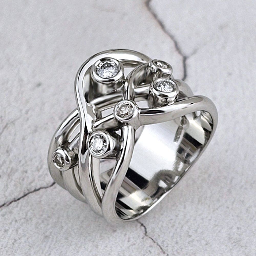 Wide platinum ring with diamonds