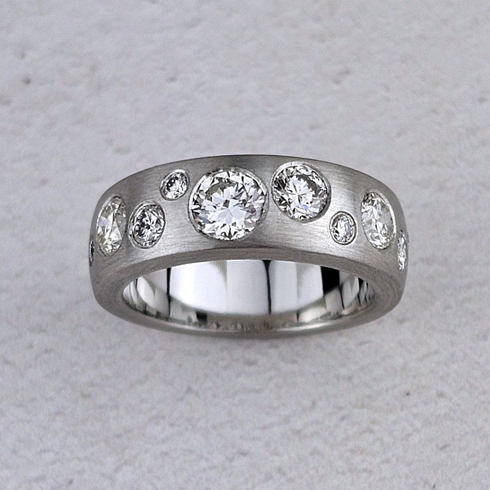 Platinum band ring with scattered diamonds