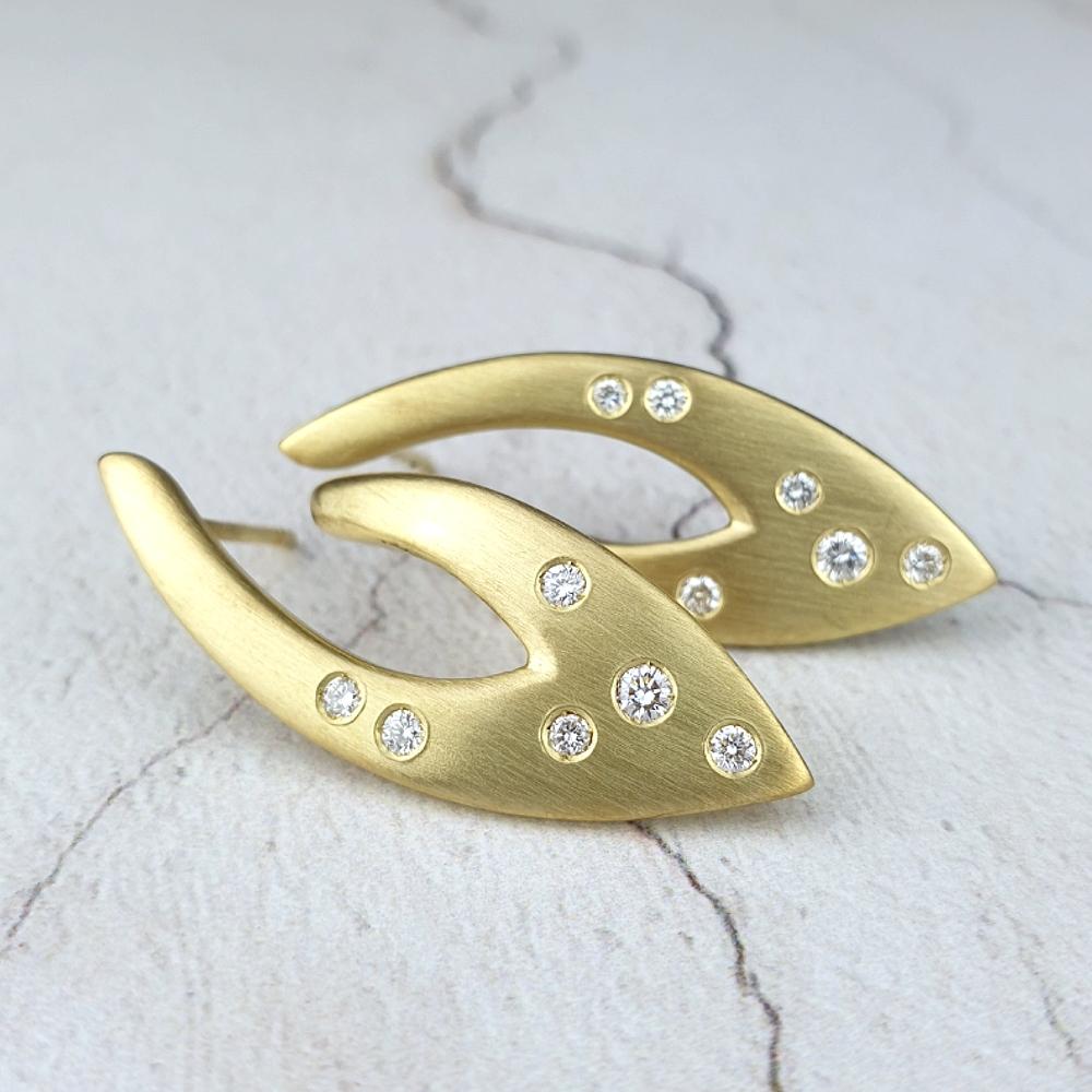 18ct yellow gold earrings with scattered diamonds.
