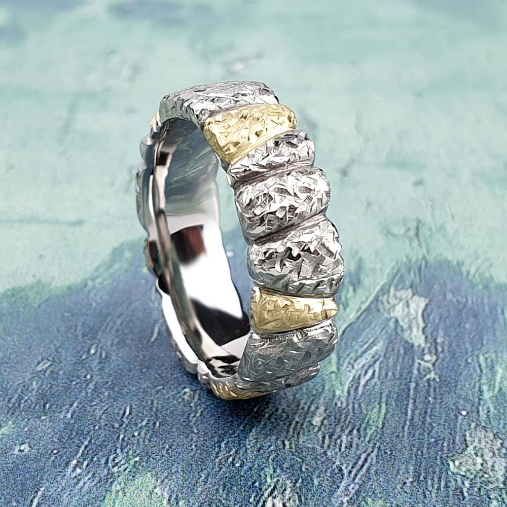 Wedding band carved into segmented design