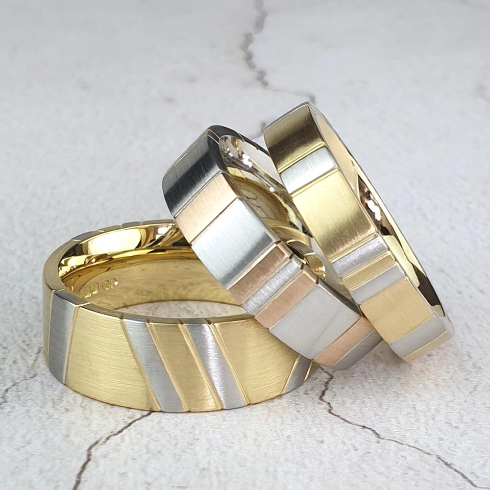 Wedding rings with inlaid stripes in a different colour