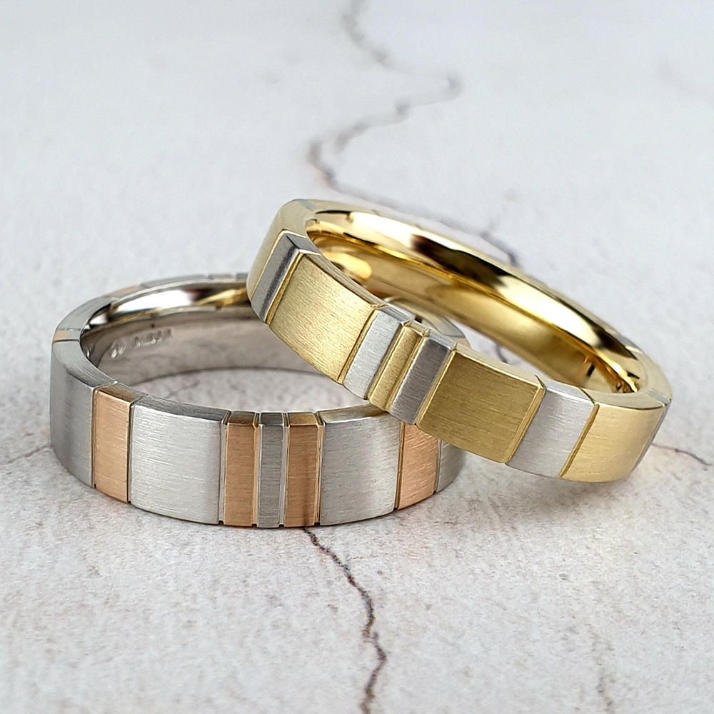 Wedding rings with inlaid stripes in a different colour