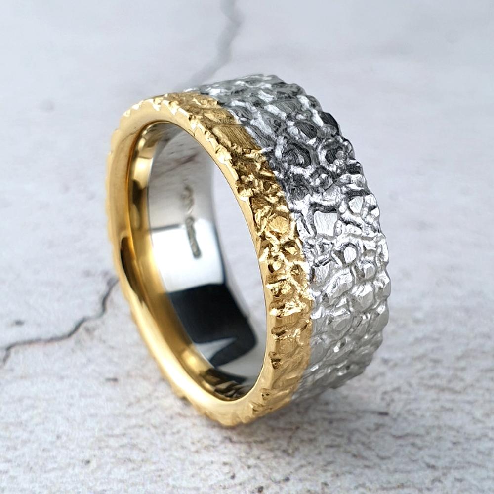 Wide platinum band combined with a narrow band of 22ct gold