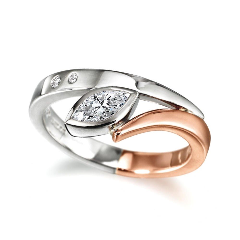 A Flick engagement ring with a marquise diamond in platinum and gold