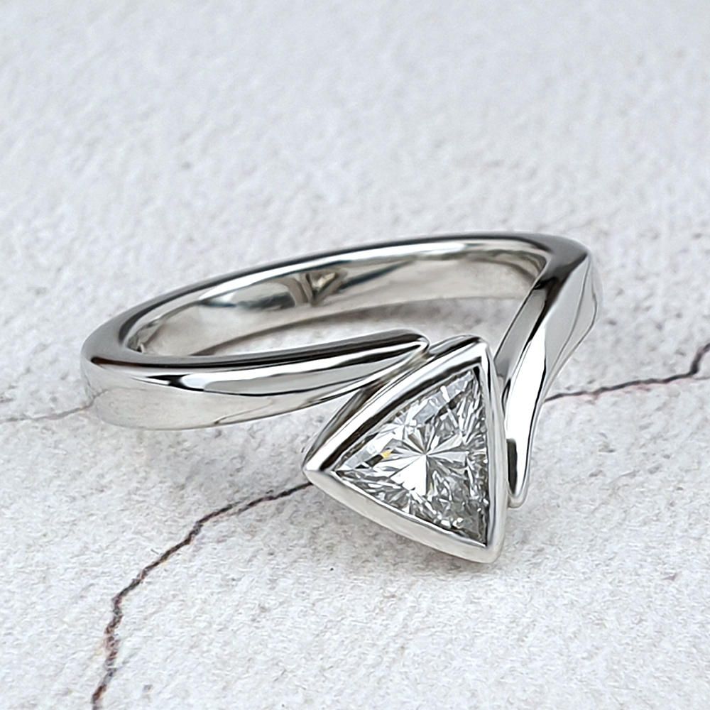 Cushion shaped halo ring with diamonds