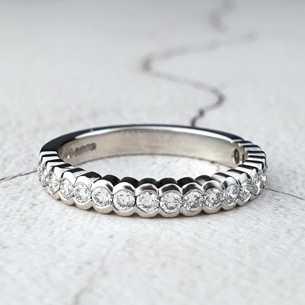 Platinum diamond eternity ring with scalloped edges