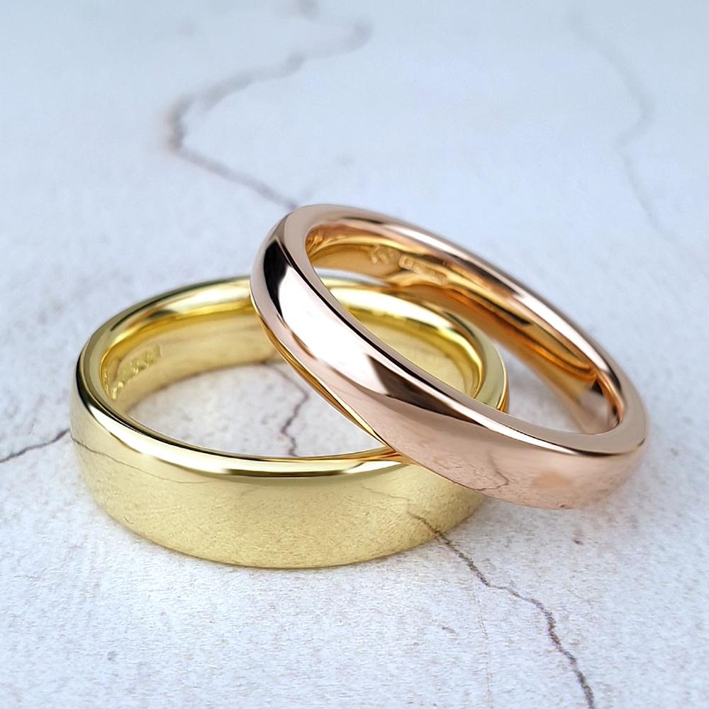 Polished red and yellow gold court rings