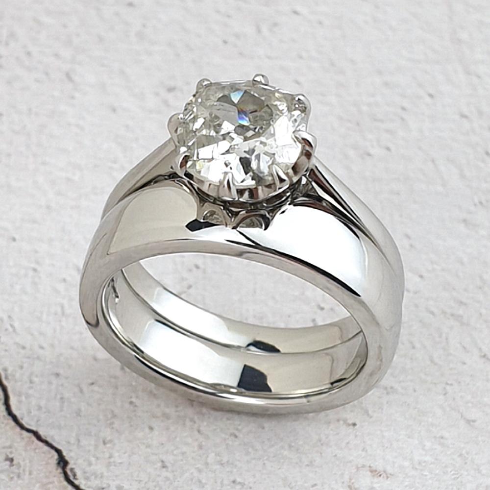 platinum wedding ring cut to fit the solitaire engagement ring
