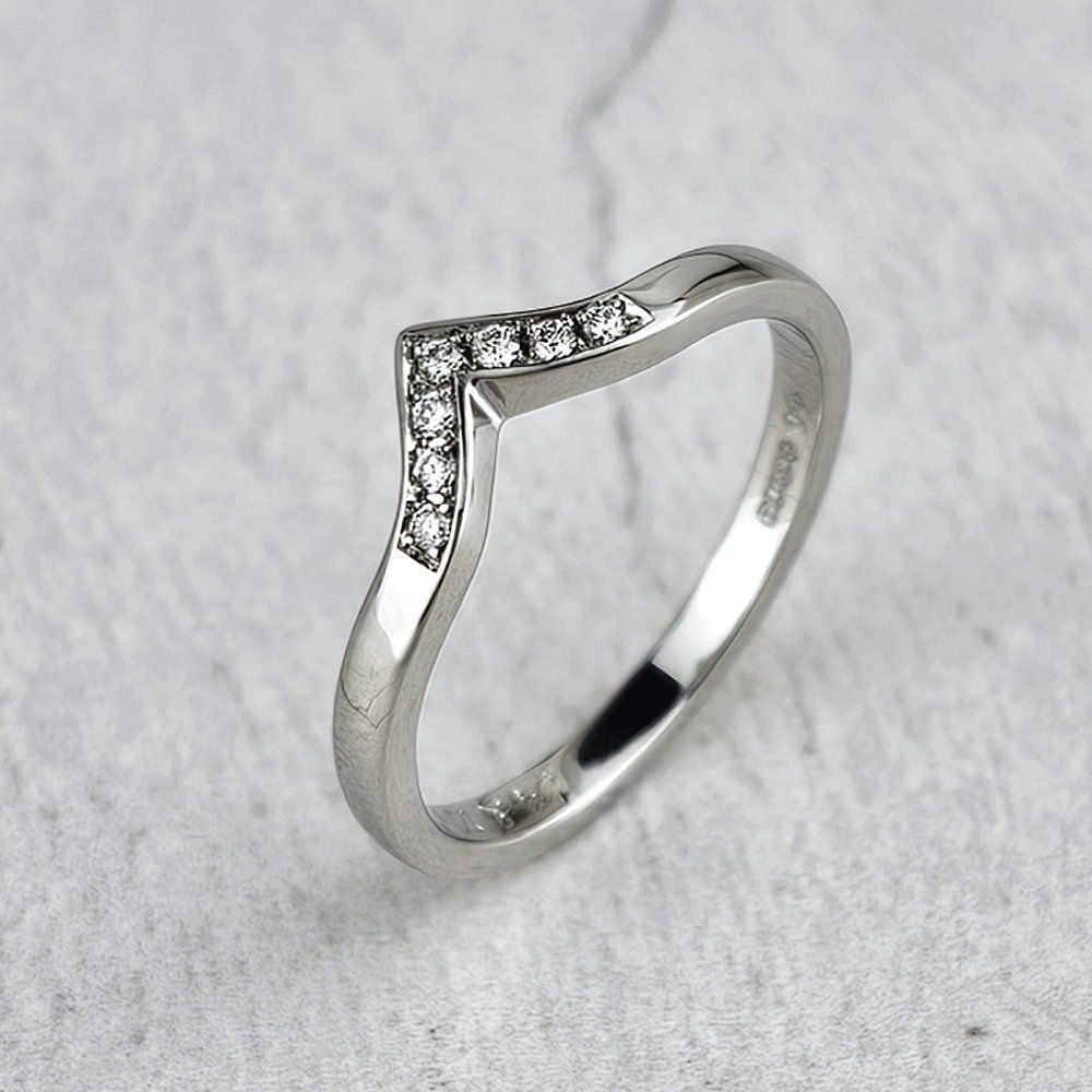 Platinum wishbone wedding ring with small diamonds