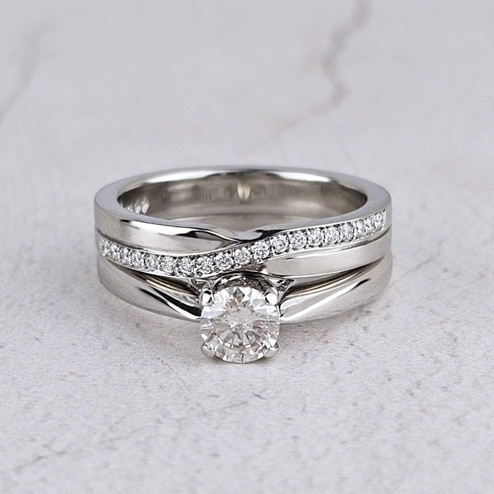 A twist-effect wedding ring with the engagement ring