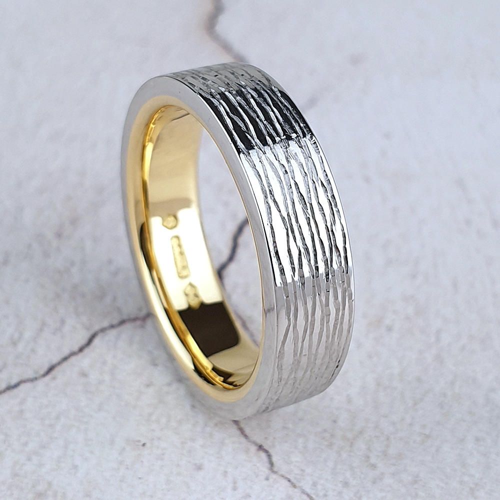 Platinum wedding ring with gold inside