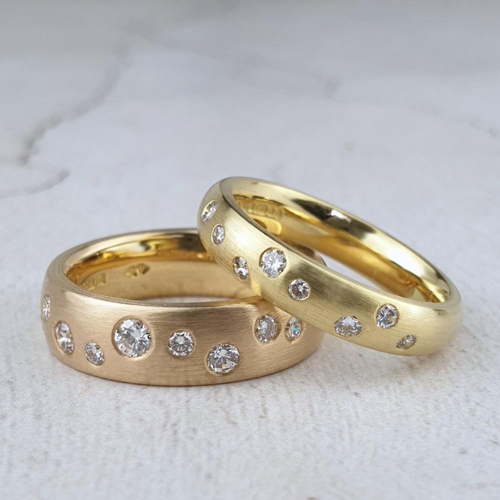 Red and yellow gold court bands with scattered diamonds