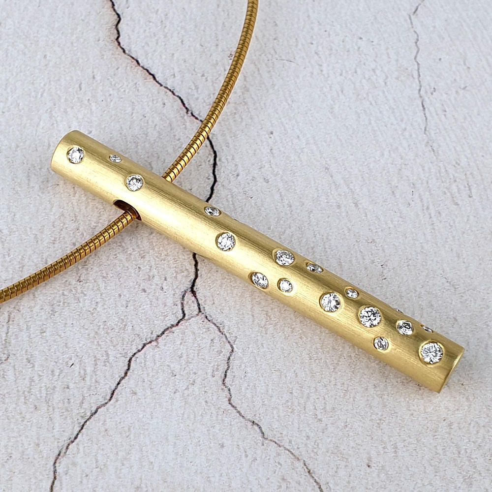 tubular 18ct yellow gold pendant with scattered diamonds