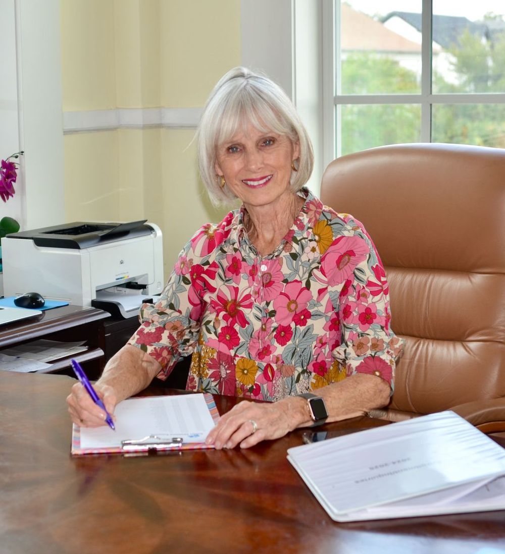 Photo of Susan Sessions at her desk