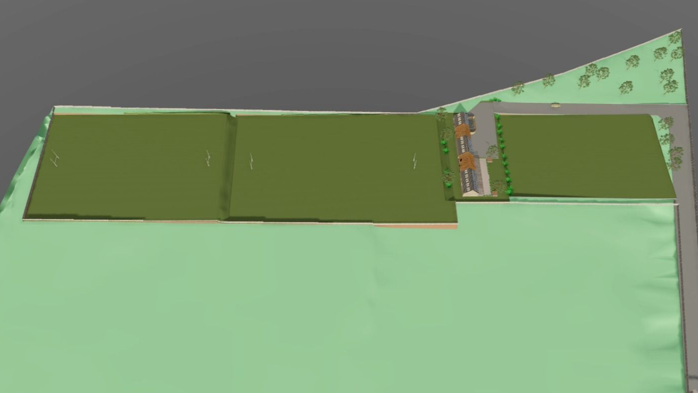 Vista aérea de un parque con campos de césped verde y pequeños árboles, pasarelas y caminos.