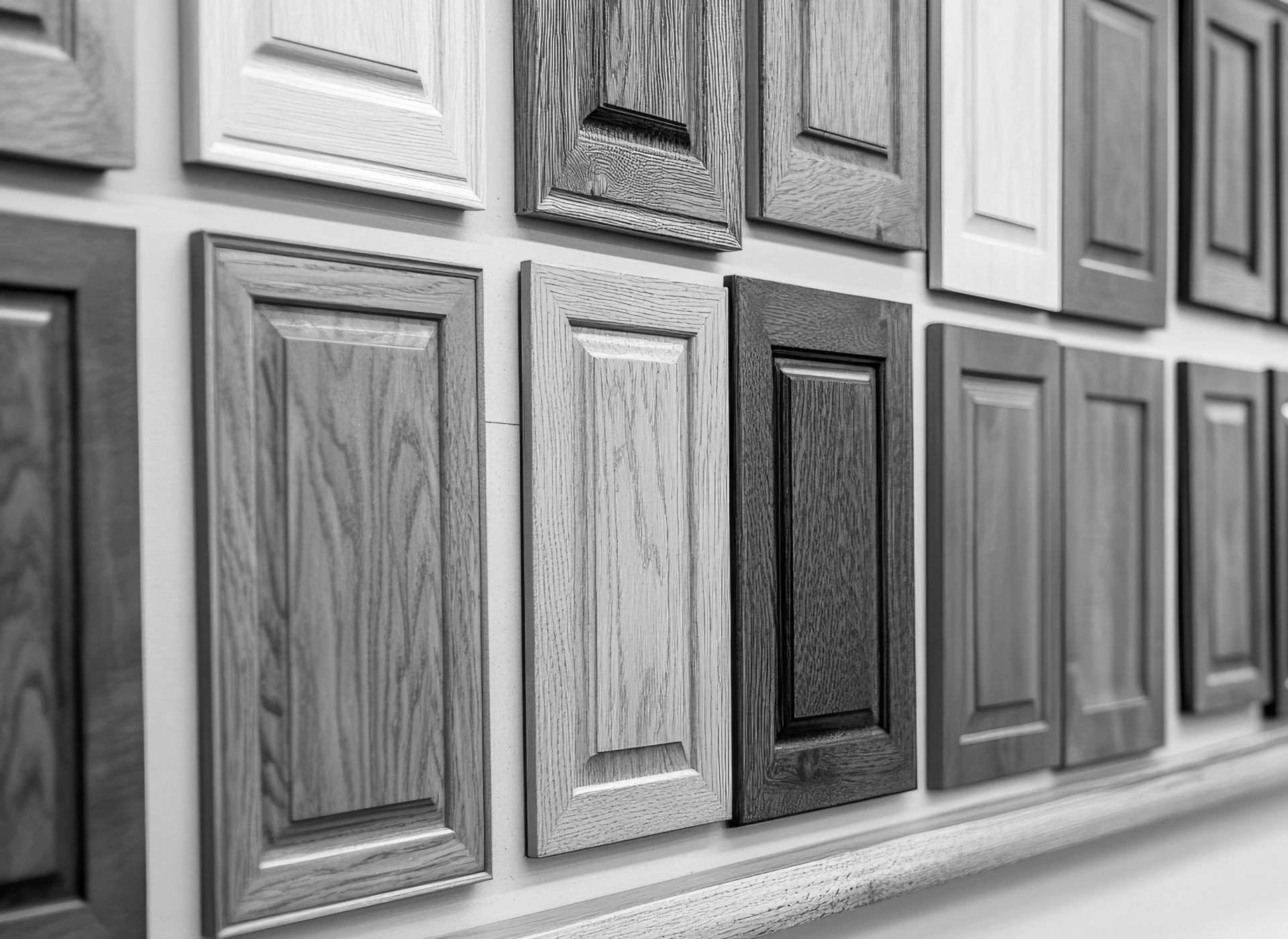 Wooden cabinet door samples in various shades and styles.