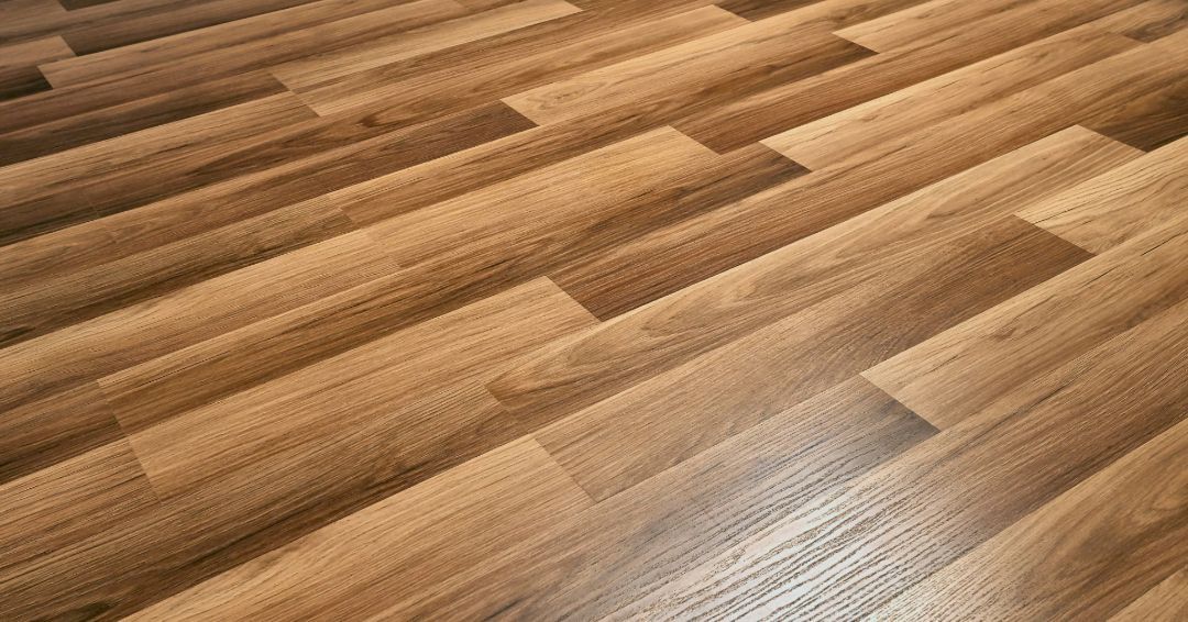 Wooden floorboards in a diagonal pattern, light brown with wood grain detail.