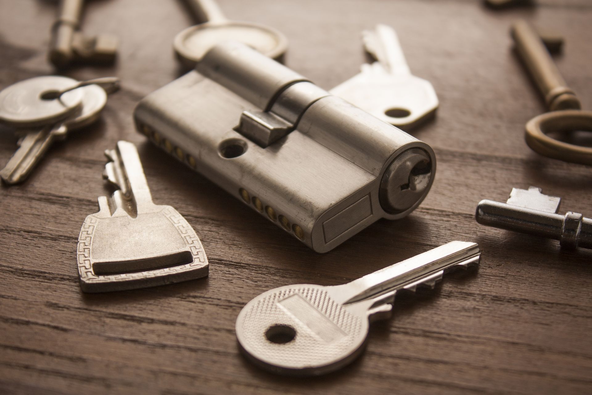 A metallic door lock cylinder.