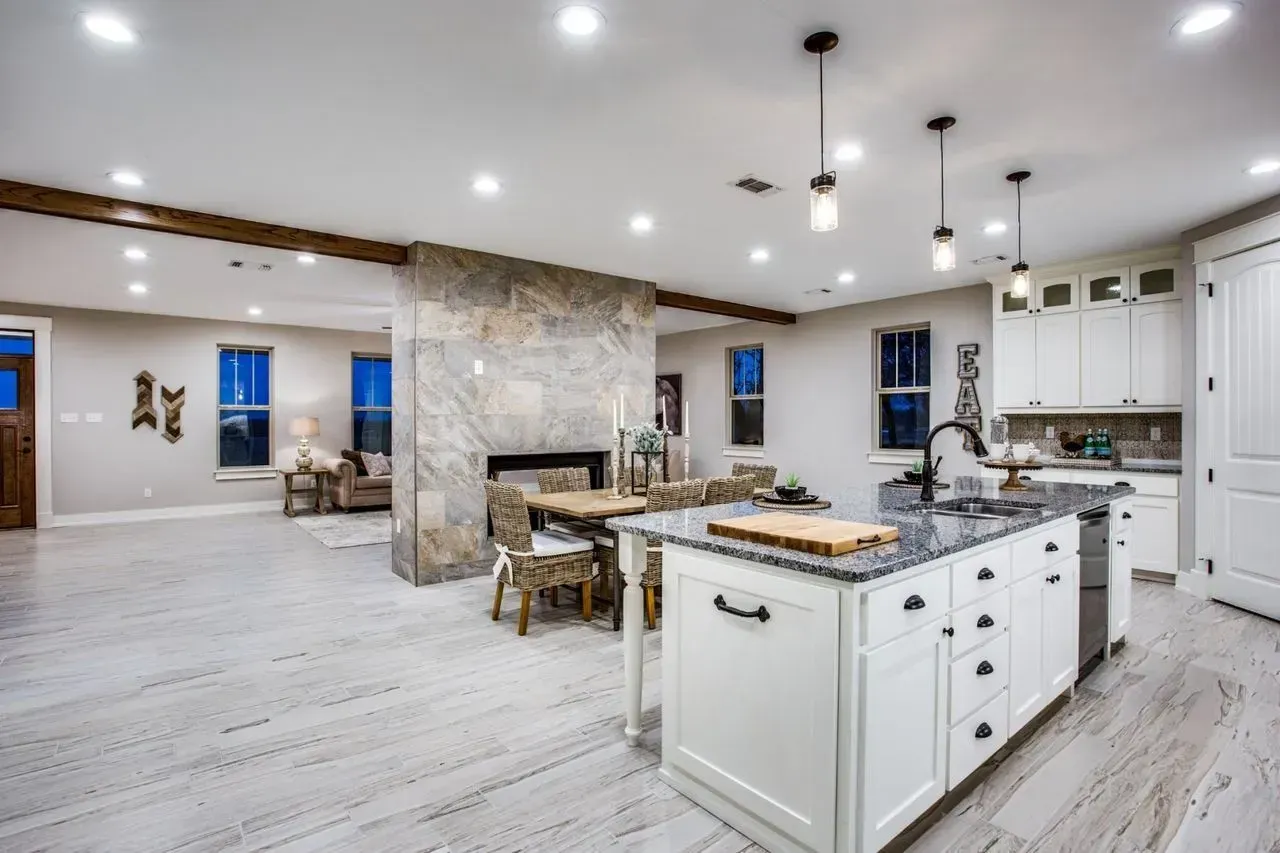 A kitchen with a large island in the middle of the room.