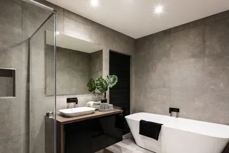 A bathroom with a bathtub , sink , mirror and walk in shower.