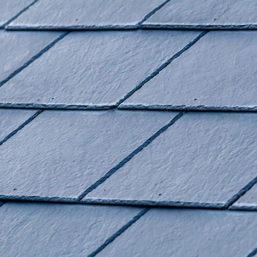 A close up of a blue tile roof