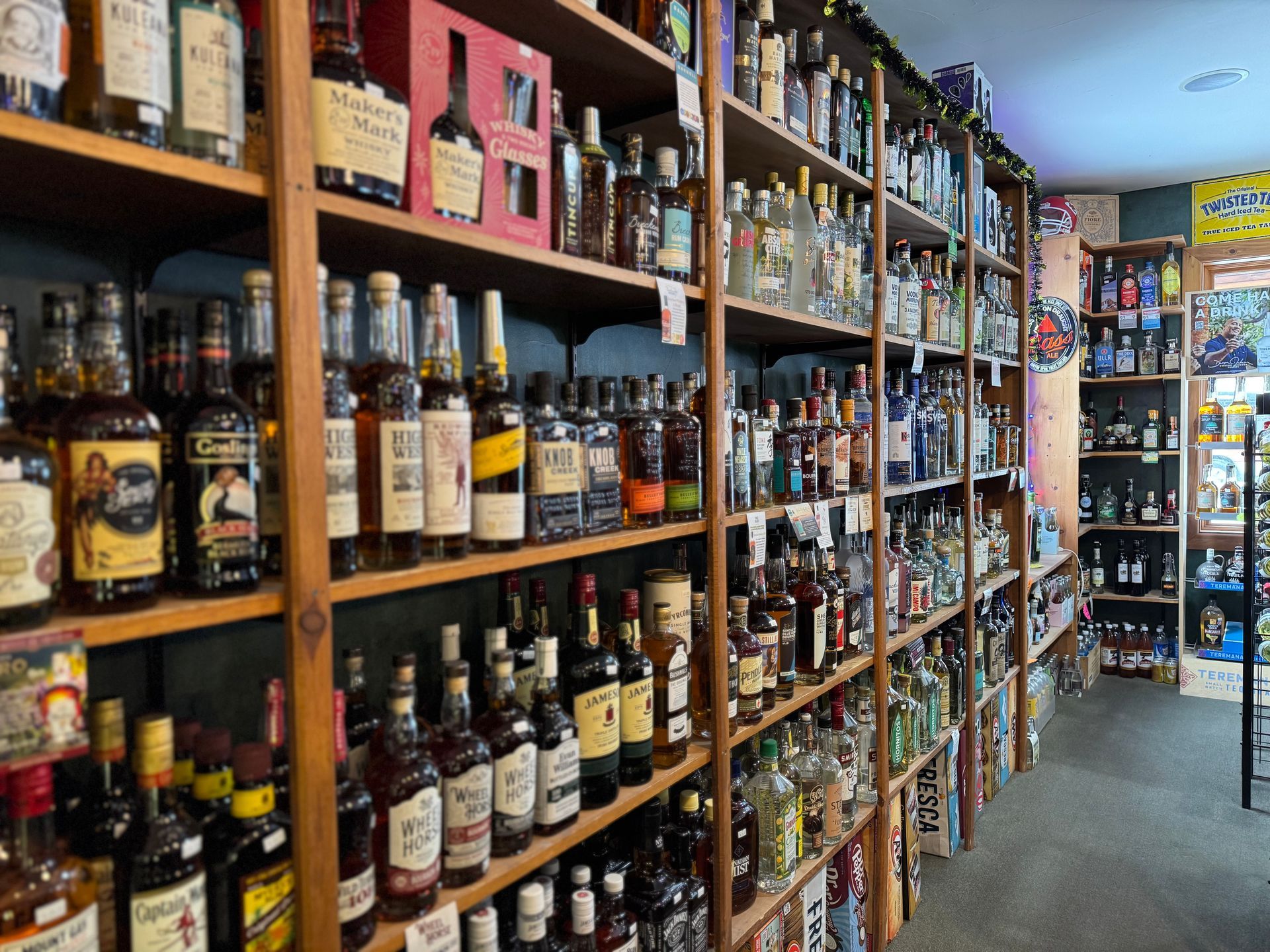 A liquor store filled with lots of bottles of liquor on shelves.