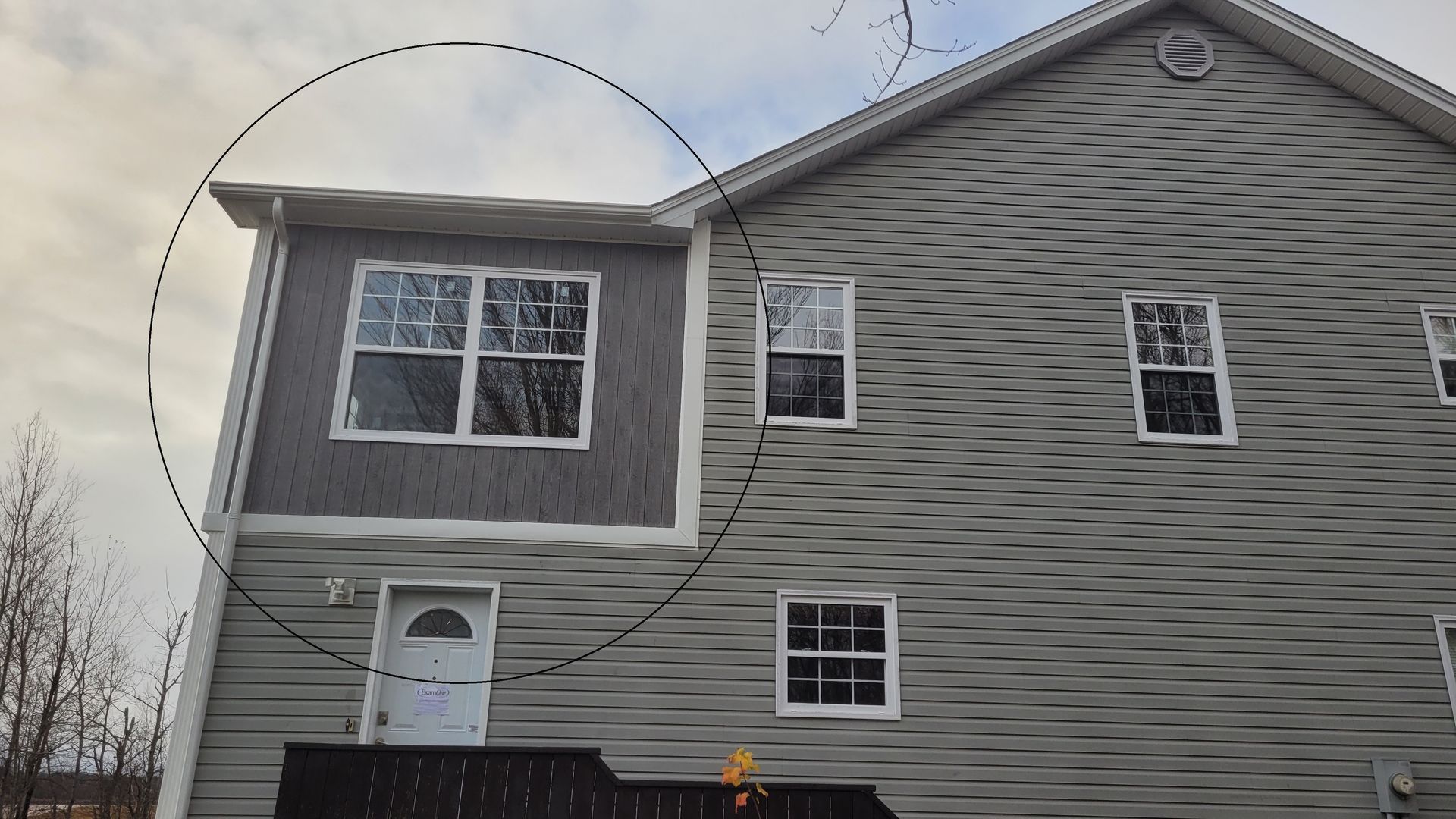 A picture of a house with a circle around it.