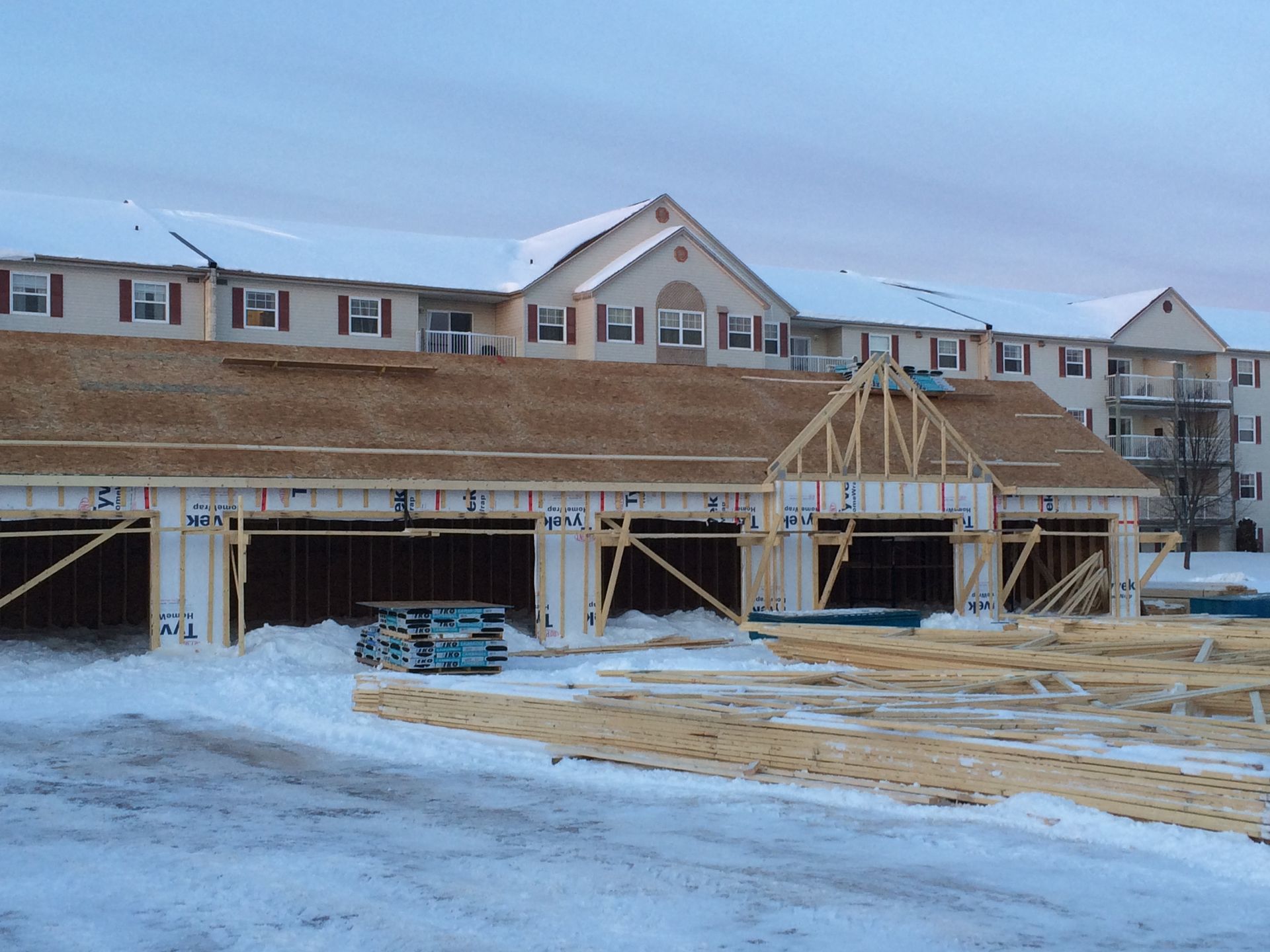 A large building under construction in the snow