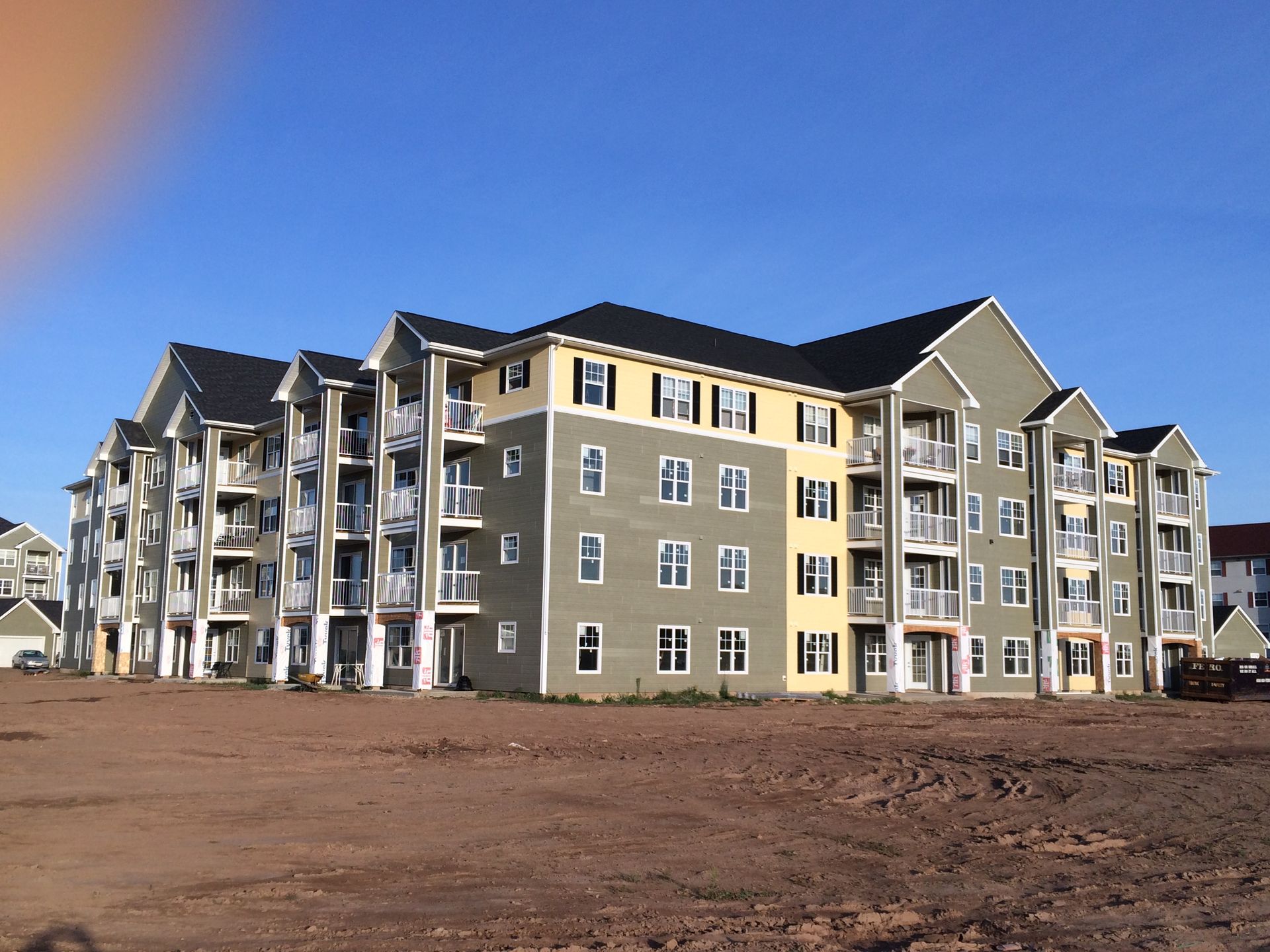 A large apartment building with a lot of windows and balconies