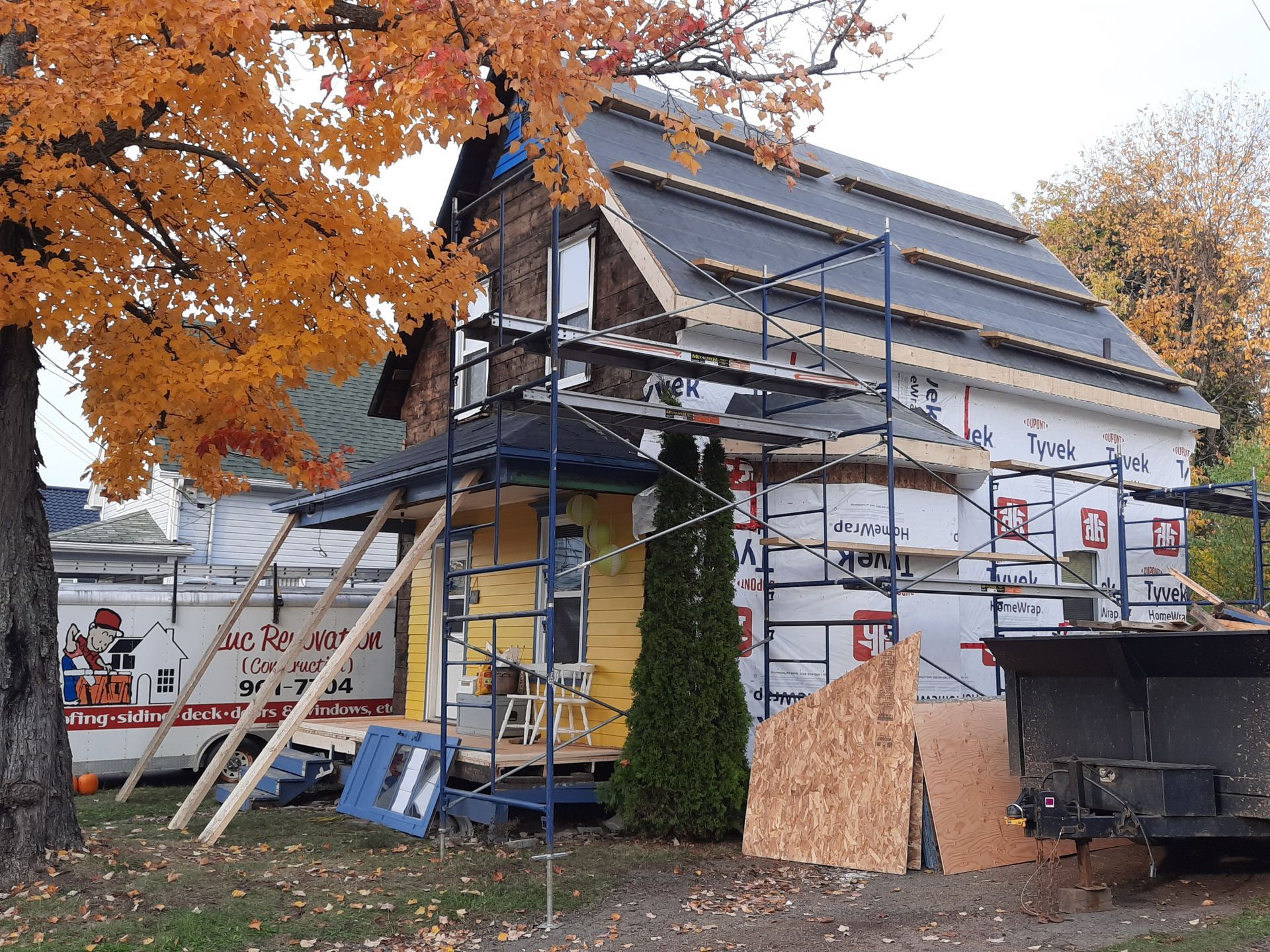 A house that is being remodeled with scaffolding around it